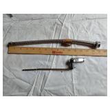 Assorted Plumbing Supplies and Tools including Drill Powered Drain Auger, Toilet Seat, and Various Fittings