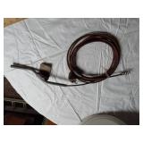 Assorted Plumbing Supplies and Tools including Drill Powered Drain Auger, Toilet Seat, and Various Fittings