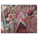 Woven Rug with Geometric Patterns approximately 7 feet 5 inches by 5 feet 3 inches