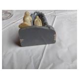 Decorative Items including Ceramic Figurine, Glass Jars, and Candle Holder