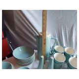 Mid-century modern dinnerware set including bowls, cups, pitchers, and serving pieces