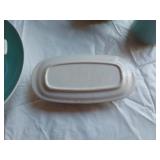 Mid-century modern dinnerware set including bowls, cups, pitchers, and serving pieces
