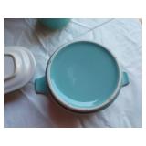 Mid-century modern dinnerware set including bowls, cups, pitchers, and serving pieces