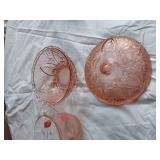 Vintage kitchenware set including Menschik-Goldman measuring cups, pink Depression glass bowls, and floral glass mugs