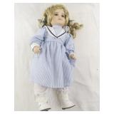Genuine Porcelain Doll with Blonde Hair in Blue Striped Dress