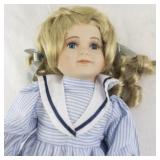 Genuine Porcelain Doll with Blonde Hair in Blue Striped Dress