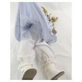 Genuine Porcelain Doll with Blonde Hair in Blue Striped Dress