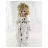 Porcelain Collectible Doll in White Lace Dress with Floral Accents