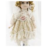 Sweetheart Collection Porcelain Doll with Curly Hair and Floral Dress