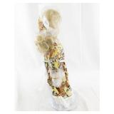 Vintage Porcelain Doll with Blonde Hair and Floral Dress