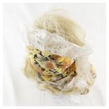 Vintage Porcelain Doll with Blonde Hair and Floral Dress