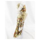 Vintage Porcelain Doll with Blonde Hair and Floral Dress