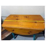 Vintage Drop-Leaf Table with Rustic Finish and Measuring Tape