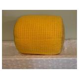 Yellow Fabric Ottoman and Green Sleeping Bag with Stuff Sack