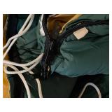Yellow Fabric Ottoman and Green Sleeping Bag with Stuff Sack