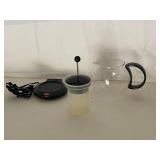 Collection of Kitchen Items Including Hammered Metal Ice Bucket, Glass Vase, and Bodum Electric Teapot