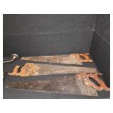 Antique tools. 3 vintage hand saws and 1 ratcheting brace drill