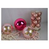 Collection of Pink and Pastel Christmas Ornaments and Santa Figurines