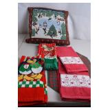 Holiday-themed towels and decorative pillow