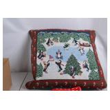 Holiday-themed towels and decorative pillow