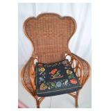 Wicker Armchair with Embroidered Floral Cushions