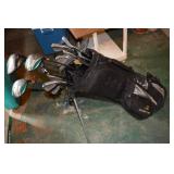 Cobra golf bag with assorted golf clubs