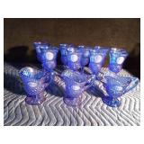 9 Blue Avon goblets and 3 small blue Avon pitchers