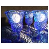 9 Blue Avon goblets and 3 small blue Avon pitchers