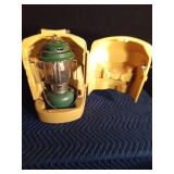 1973 Coleman green lantern with yellow case, key and funnel