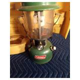 1973 Coleman green lantern with yellow case, key and funnel