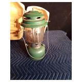 1973 Coleman green lantern with yellow case, key and funnel
