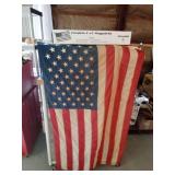 2 American flags (1 in a box and 1 on a pole)