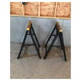 2 fold-up plastic sawhorses