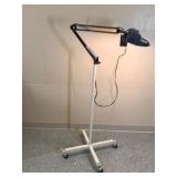 floor lamp with magnifying glass on wheels
