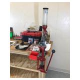 Table with Hornaday lock n load auto progressive reloading press attached with reloading equipment and more- can be shipped without table