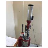 Table with Hornaday lock n load auto progressive reloading press attached with reloading equipment and more- can be shipped without table