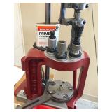 Table with Hornaday lock n load auto progressive reloading press attached with reloading equipment and more- can be shipped without table