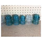 2 wood bowling pins, old casters, vintage bottles, glass insulators