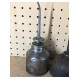 3 Vintage thumb press oil cans and 1 Coleman #0 Filler funnel
