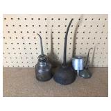 3 Vintage thumb press oil cans and 1 Coleman #0 Filler funnel