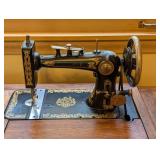 ML - Vintage Brunswick Treadle Sewing Machine with Ornate Oak Cabinet