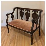 ML - Antique Wood Settee with Pink Upholstered Seat and Carved Lion Armrests