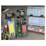 Vintage Fishing Tackle Box Collection with Reels, Lures, Cooler, and Accessories