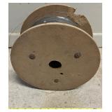 Large Spool of Metal Wire on Wooden Reel