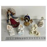 Collection of Holiday Figurines and Decor Including Angel, Nativity Egg, Bells, and Winter Children