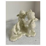 Collection of Holiday Figurines and Decor Including Angel, Nativity Egg, Bells, and Winter Children