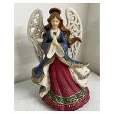 Collection of Holiday Figurines and Decor Including Angel, Nativity Egg, Bells, and Winter Children