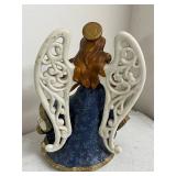 Collection of Holiday Figurines and Decor Including Angel, Nativity Egg, Bells, and Winter Children
