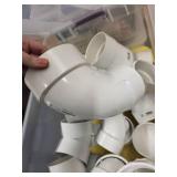 Collection of PVC Plumbing Fittings in Storage Tote