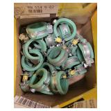 Box of BrassCraft Supply Kits and Green Pipe Clamps